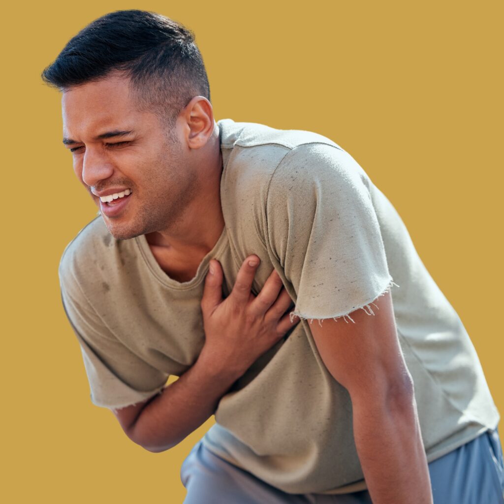 Young tanned man with hand on chest feeling heart pain - statins vs estradiol for heart health