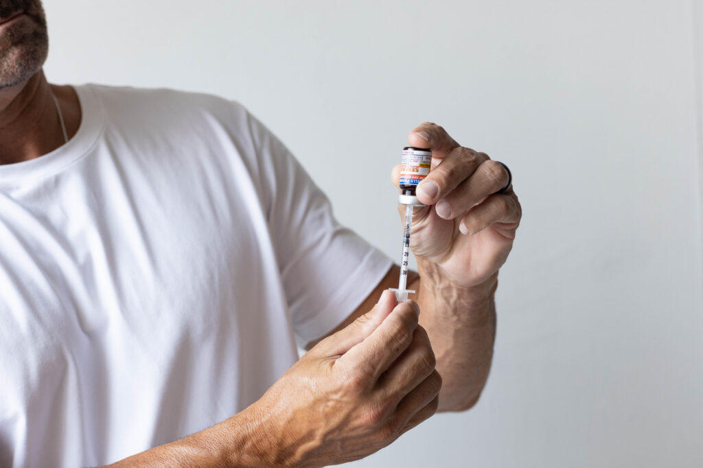 man holding semaglutide - peptides for weight loss